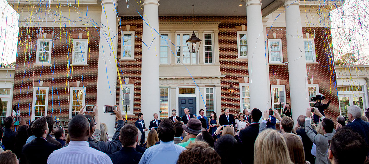 Celebration outside the alumni house with Gregory P. Klich